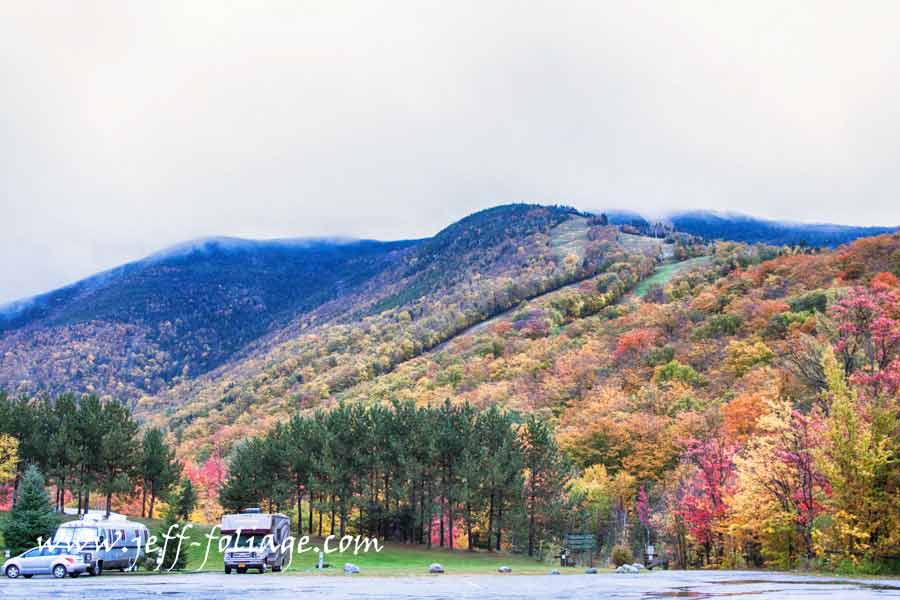 #Vistaphotography #JeffFolger, #JeffFoliage, fall color covers the side of Cannon Mountain in the New Hampshire white mountains