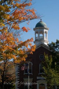 Weather green copper cupola on the top of the courthouse awaiting peak fall foliage in Woodstock 