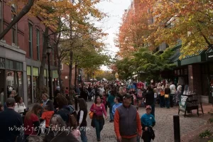 During Halloween, Crowds of people walk Essex st