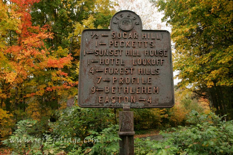 Road sign in the New Hampshire fall foliage showing the scenic drives of Sugar Hill NH