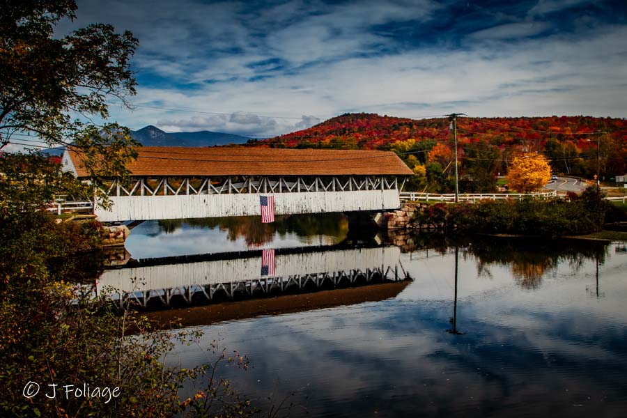 Groveton Covered Bridge surrounded by fall colors