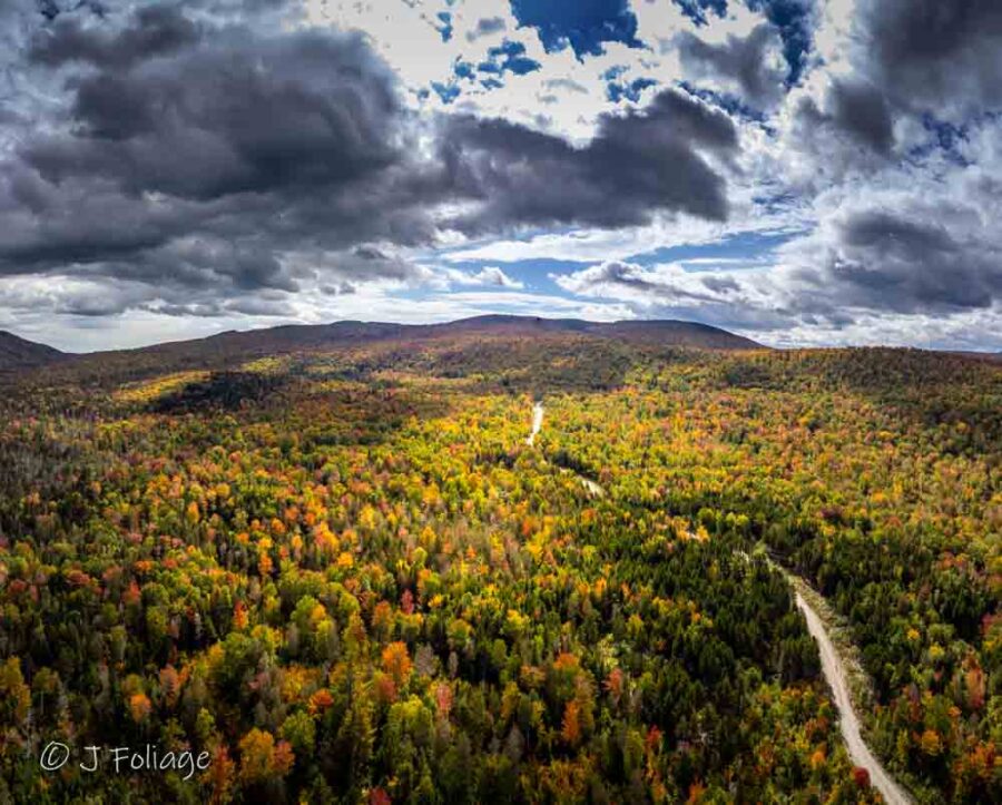 expansive autumn landscape reveals the breathtaking scale of Maine’s western mountains.