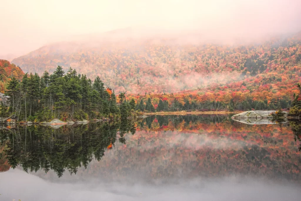 Beaver Pond on route 112 in Woodstock New Hampshire with beautiful fall colors in fog