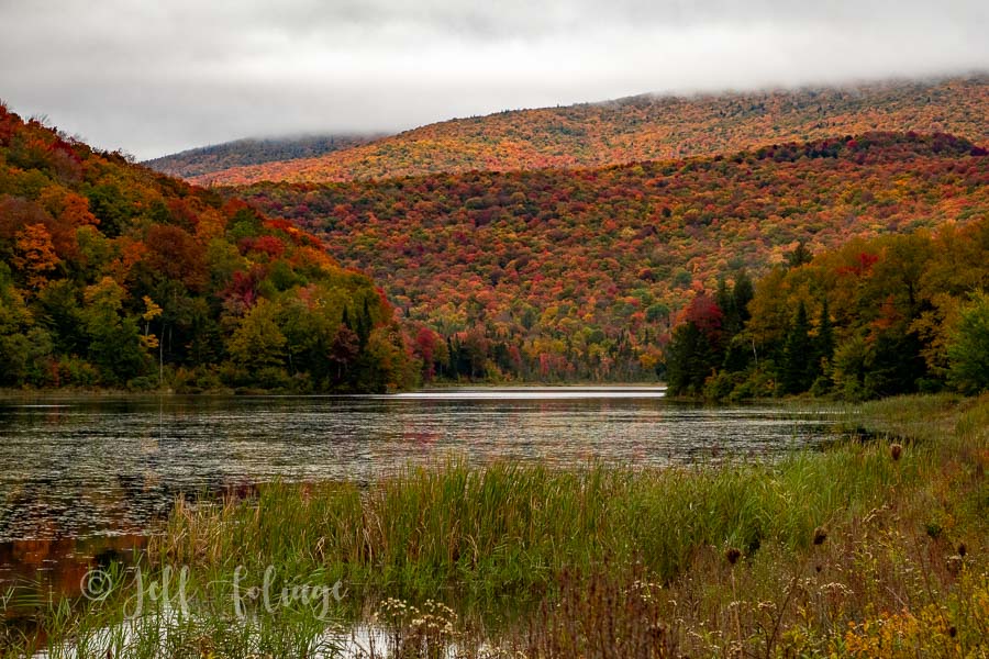 Belvidere Pond in Belvidere Vermont is at full peak fall color.