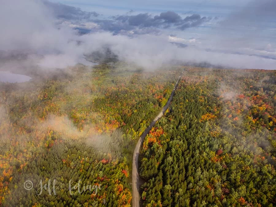 Drone view of Long Falls Dam Road in autumn