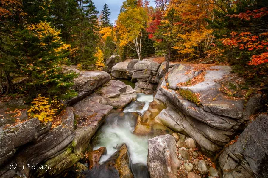 Ammonoosuc River falls in fall colors in New Hampshire