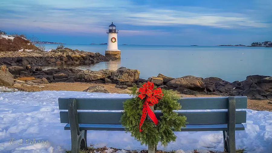 Winter Island at Christmas a park bench with a red ribbon