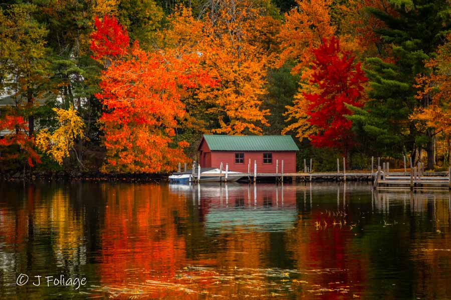 Autumn Serenity, a boat House on Lake Winnipesaukee New Hampshire under the fall colors