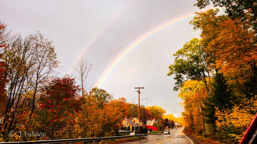 a rainbow appears over Townsend MA, The band of showers passes and cues up rainbows