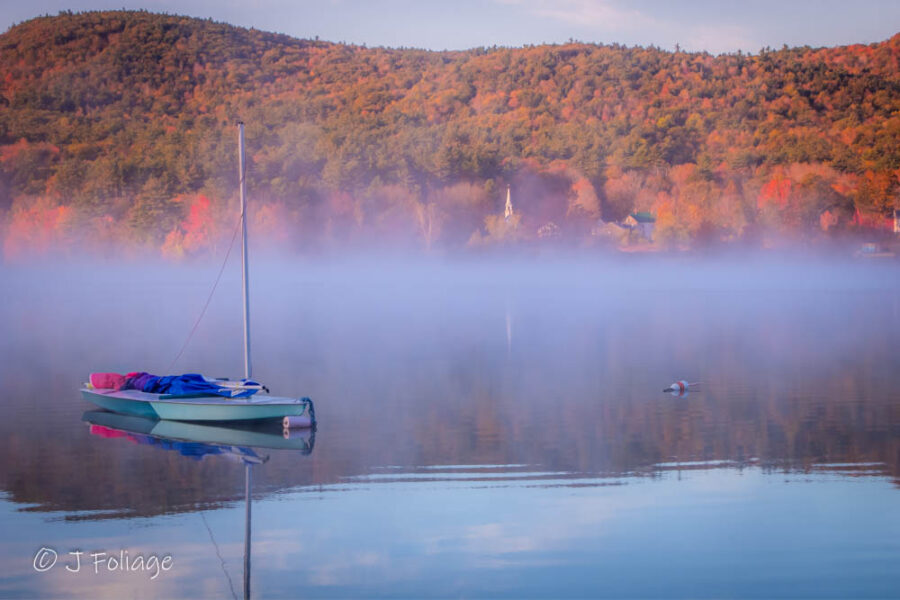 A small sailboat on Crystal Lake in Eaton NH