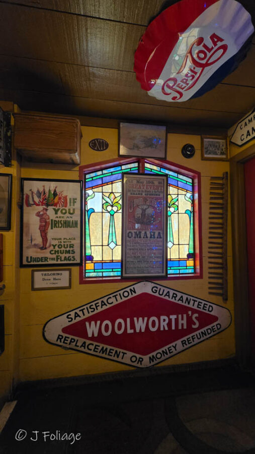 Interior Stained Glass: Close-up of a colorful vintage stained glass window inside May Kelly's Irish restaurant.
